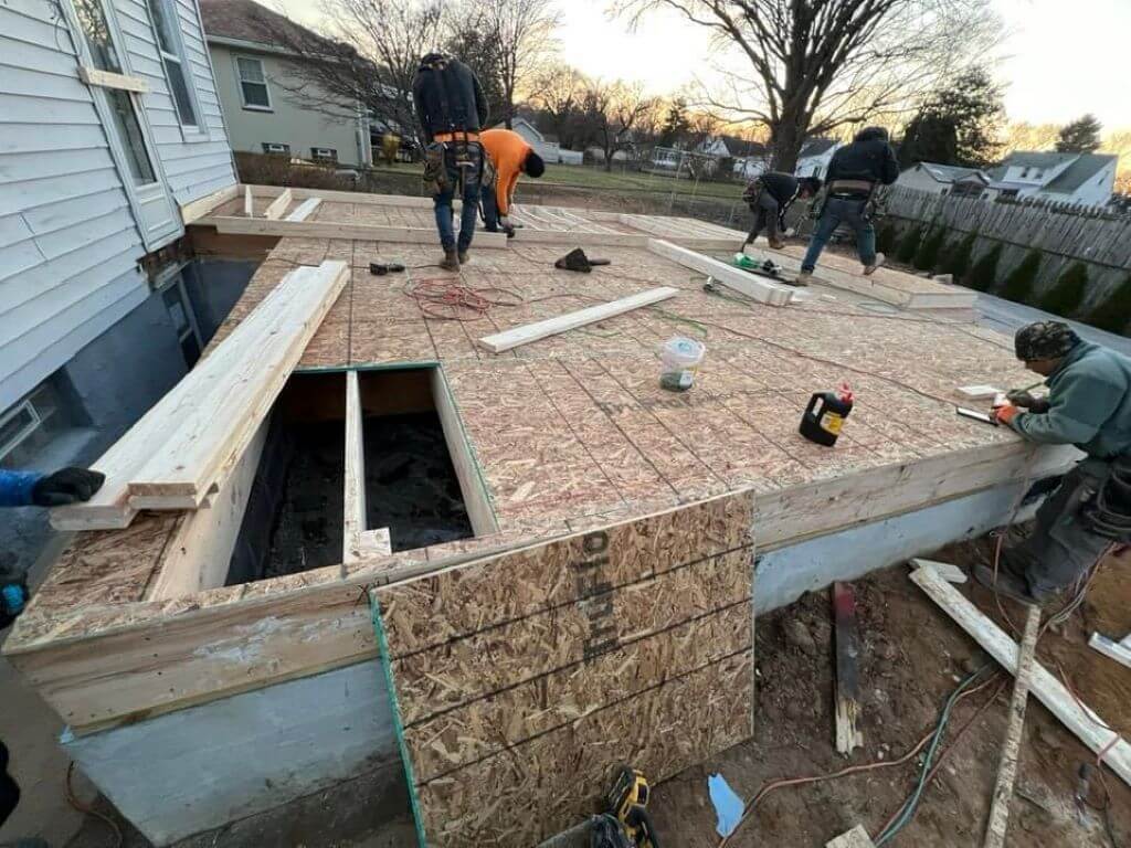 Custom home addition with a new sunroom and extended living area in Montgomery County.