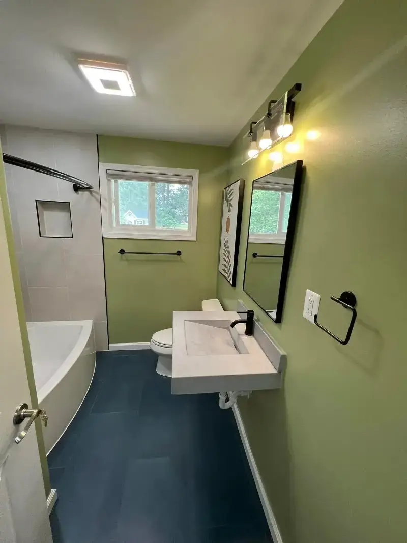 Tysons, VA bathroom renovation with double vanity and lighting.