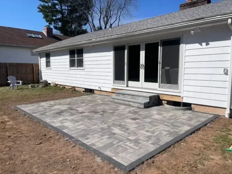 Deck remodel in Silver Spring featuring built-in seating and greenery.