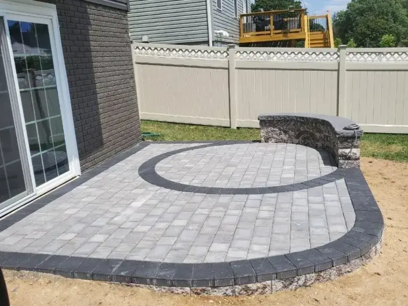 Patio installation in Potomac, MD with round seating arrangement.