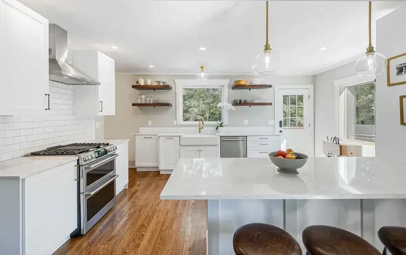 Modern kitchen remodel in Gaithersburg with sleek black cabinetry and stainless steel appliances.